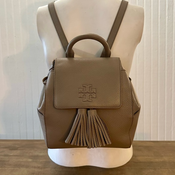 Tory Burch Handbags - Tory Burch Beige Pebbled Leather Backpack with Twin Tassels